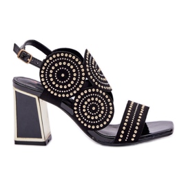 Decorated sandals on the black post