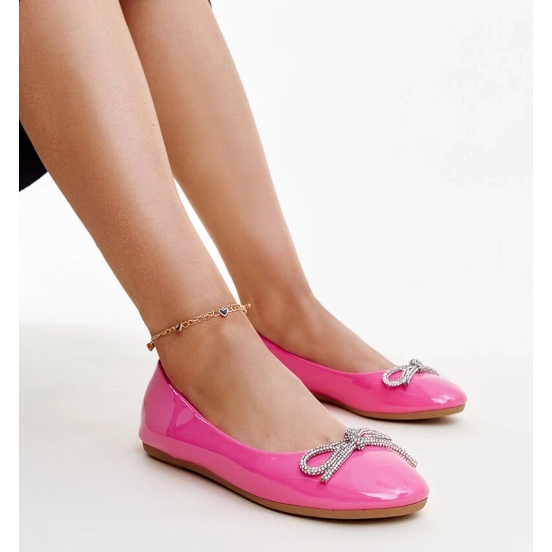 Pink patent ballet flats with a decorative bow from Totani