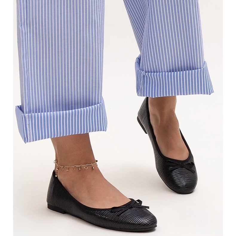 Black ballet flats with a bow and a leather insert by Rosaly