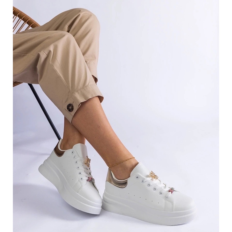 D/CEO White sneakers on the platform decorated with a butterfly arrangement