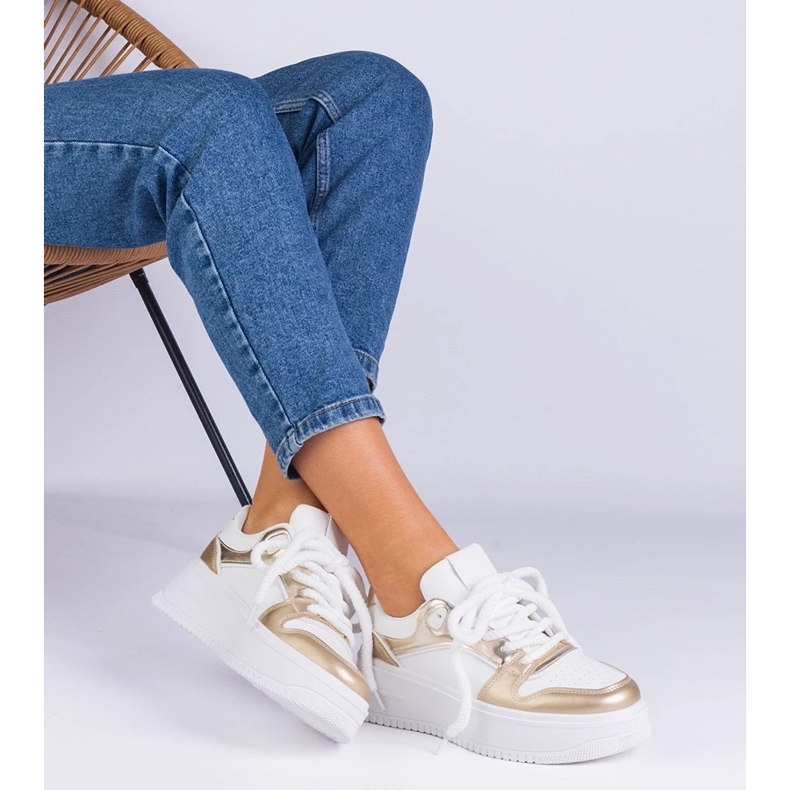 D/CEO White and gold sneakers on the Ivalda platform golden