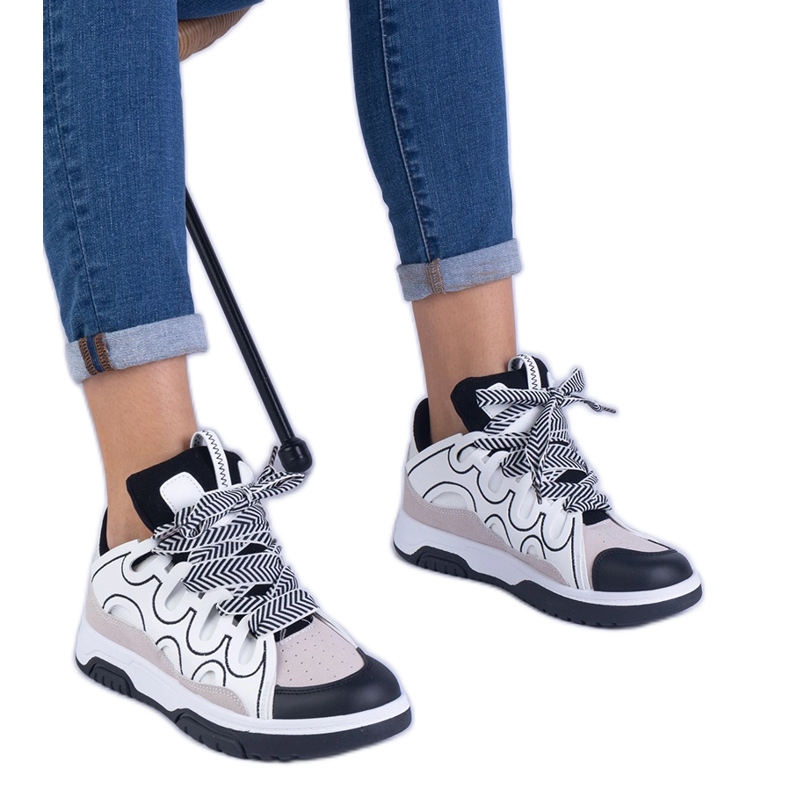 Black women's sneakers with decorative lacing Black women's sneakers with decorative lacing