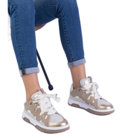 Beige women's sneakers with decorative lacing