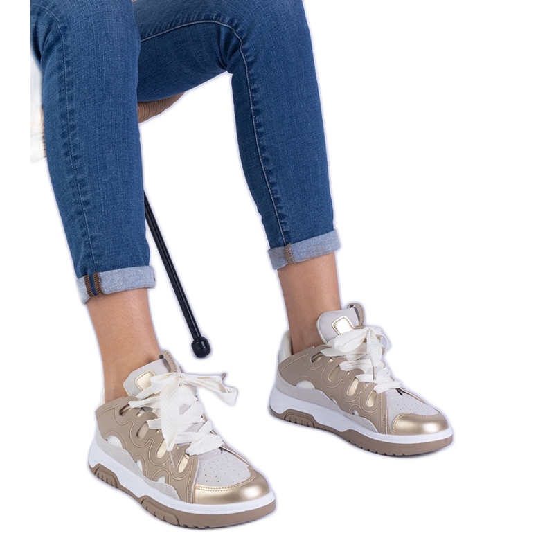 Beige women's sneakers with decorative lacing Beige women's sneakers with decorative lacing