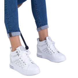 Women's white sneakers on a hidden wedge