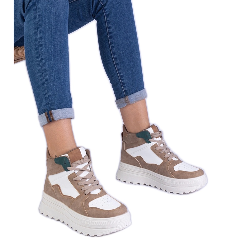 Beige women's sports sneakers on the platform