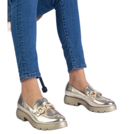 Golden classic shoes with golden decoration