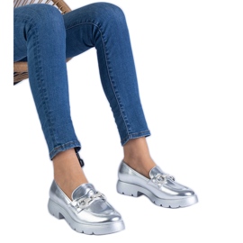 Silver classic shoes with an ornament