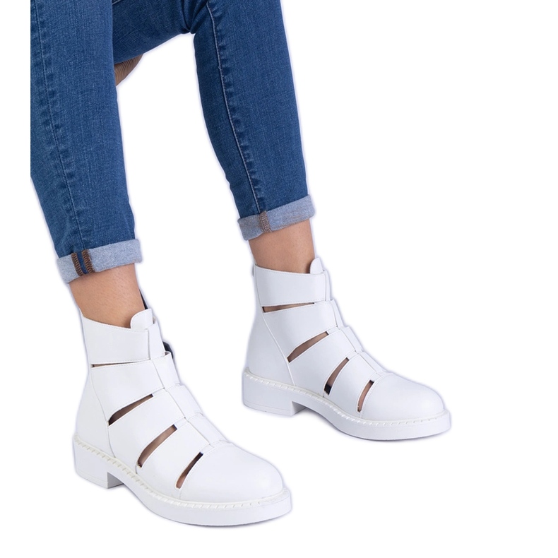 White boots with eco -leather with flat -heeled cutouts White boots with eco -leather with flat -heeled cutouts