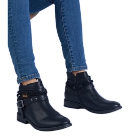 Black flat boots with a cutout and a buckle