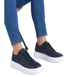 Black openwork sneakers on a massive sole Black openwork sneakers on a massive sole