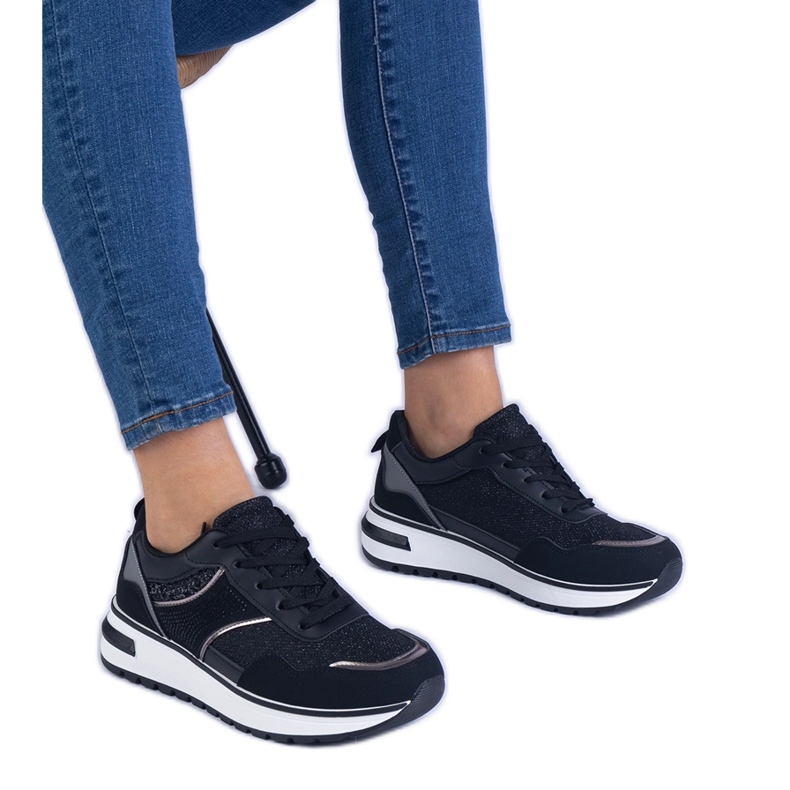 Black sneakers decorated with glitter and zircons