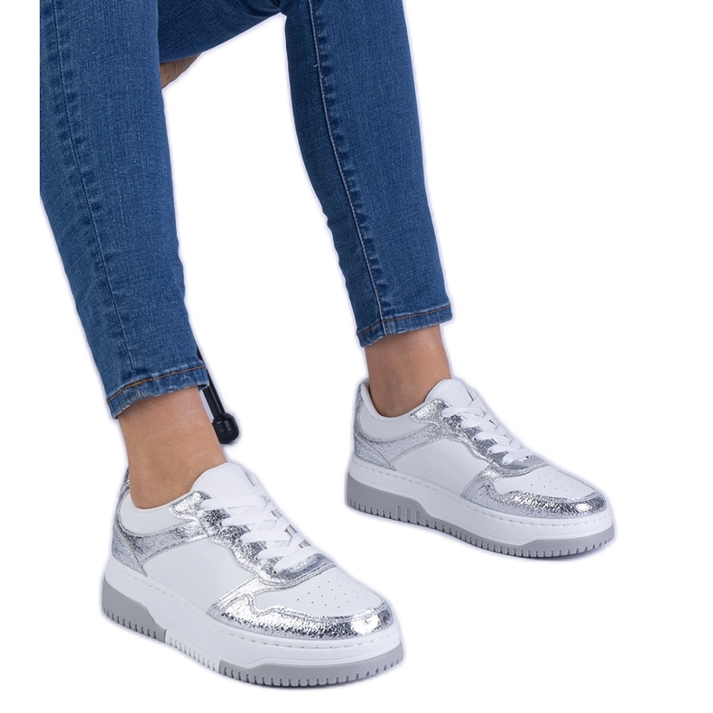 Silver sneakers on a thick sole Silver sneakers on a thick sole