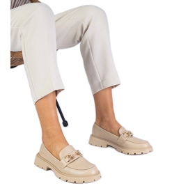 Beige women's loafers with a golden decoration Beige women's loafers with a golden decoration
