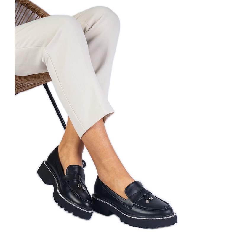 Black moccasins decorated with rhinestones