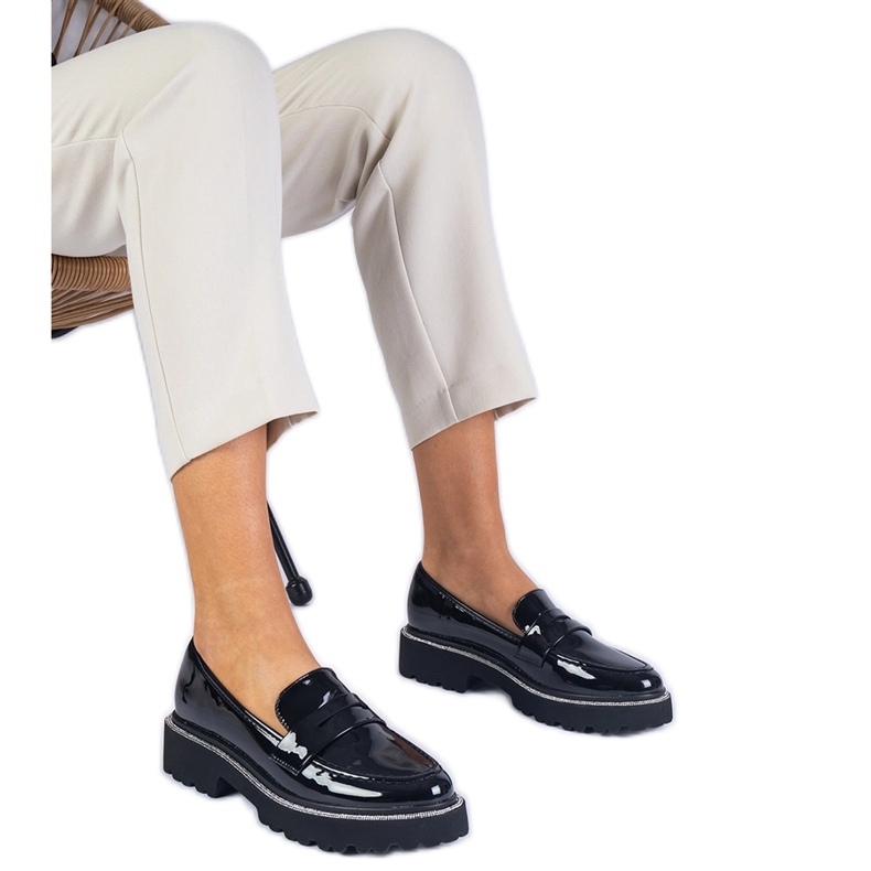 Black varnished loafers decorated with zircons
