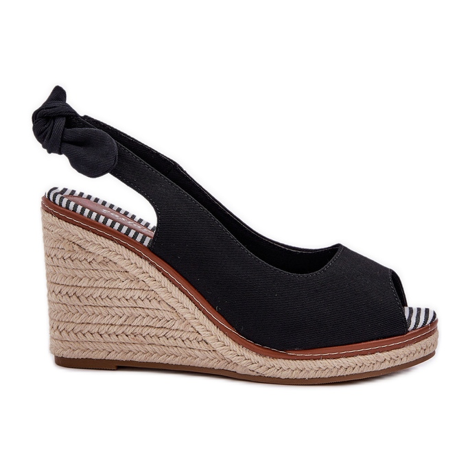 Black sandals on a wedge heel with a braid