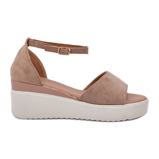Light sandals on the platform and a delicate wedge beige