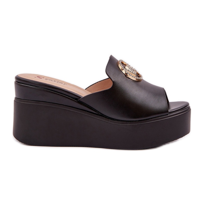 Slippers on the platform and wedges with a black decoration