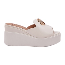 Slippers on the platform and wedges with a white ornament Slippers on the platform and wedges with a white ornament