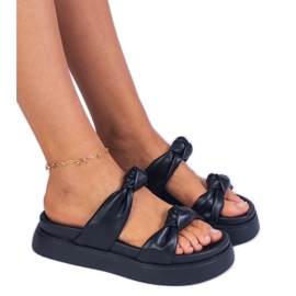 Black slippers on the platform