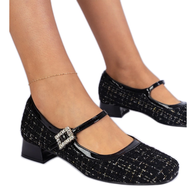 Black pumps with a material finish with zircons