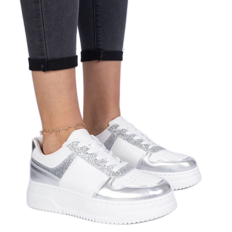 Silver women's sneakers on a thick sole