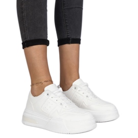 White women's sneakers with a thick sole