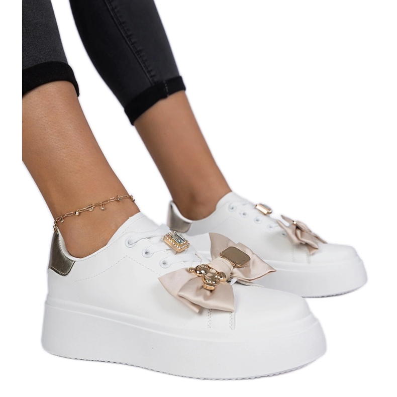 Women's white and gold sneakers with a bow