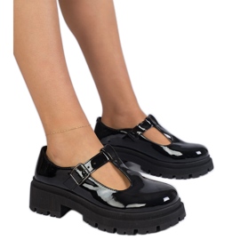 Black shoes on the varnished platform