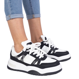 Black and white sneakers with thick laces