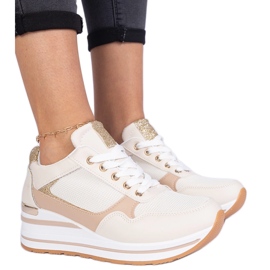 Beige sneakers decorated with glitter and a metal insertion