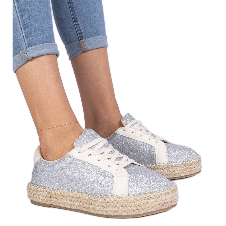 Silver women's espadrilles decorated with glitter