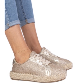 Golden women's espadrilles decorated with glitter Golden women's espadrilles decorated with glitter