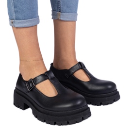 Black shoes on the eco -leather platform