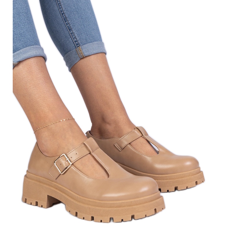 Brown shoes on the eco -leather platform