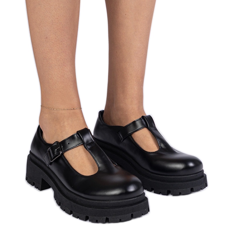Black shoes on the eco -leather platform