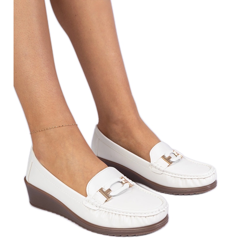 White women's moccasins on ancody of eco -leather White women's moccasins on ancody of eco -leather