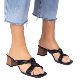 Black elegant flip flops on the block