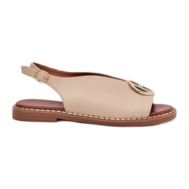 Flat elegant sandals with a beige decoration