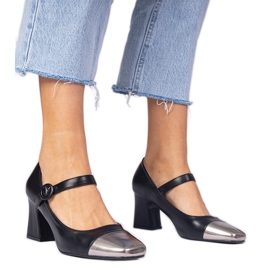 Black women's pumps with a silver toe