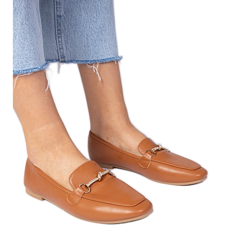 Brown elegant loafers with a golden decoration and zircons Brown elegant loafers with a golden decoration and zircons