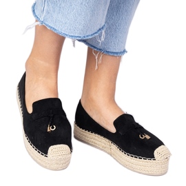 Black espadrilles on a thick sole