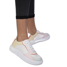 White and yellow sports sneakers from eco-leather White and yellow sports sneakers from eco-leather