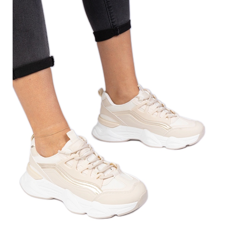 Beige women's sneakers with a golden addition