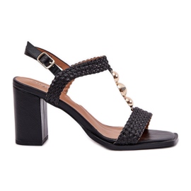 Women's sandals on the post with an ornament and black braid