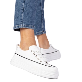 White women's sneakers on a high sole