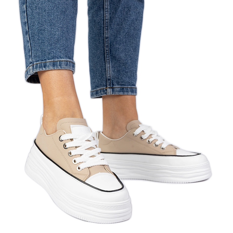 Beige women's sneakers on a high sole