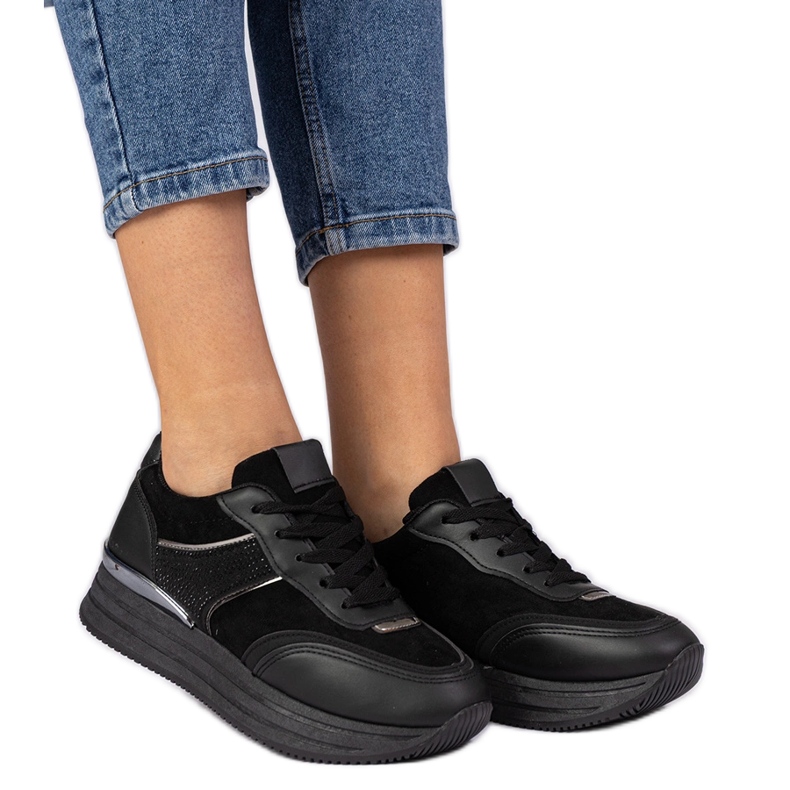 Black women's sneakers on the platform with zircons