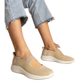 Beige women's sneakers on a pressed sole